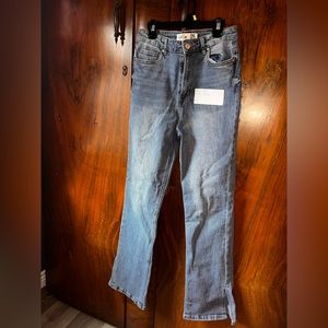 Medium wash. Mid rise slim flare. Size 5.